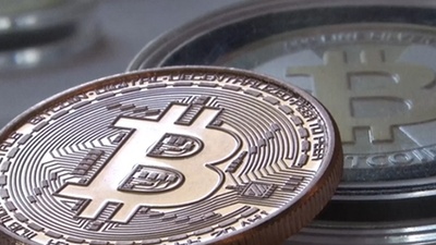 A detailed view of a Bitcoin miner in action, showcasing its intricate components that require regular maintenance to sustain efficient BTC mining operations